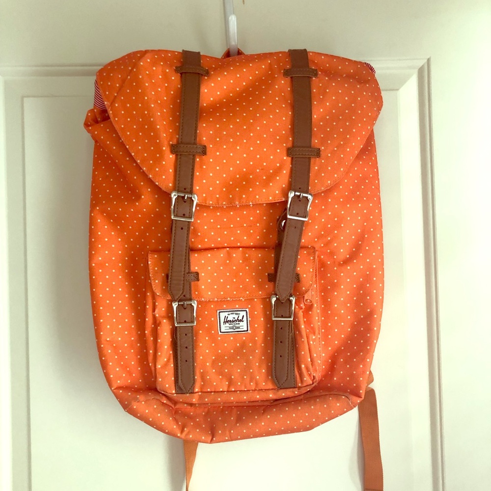 Orange polka dot backpack with laptop sleeve